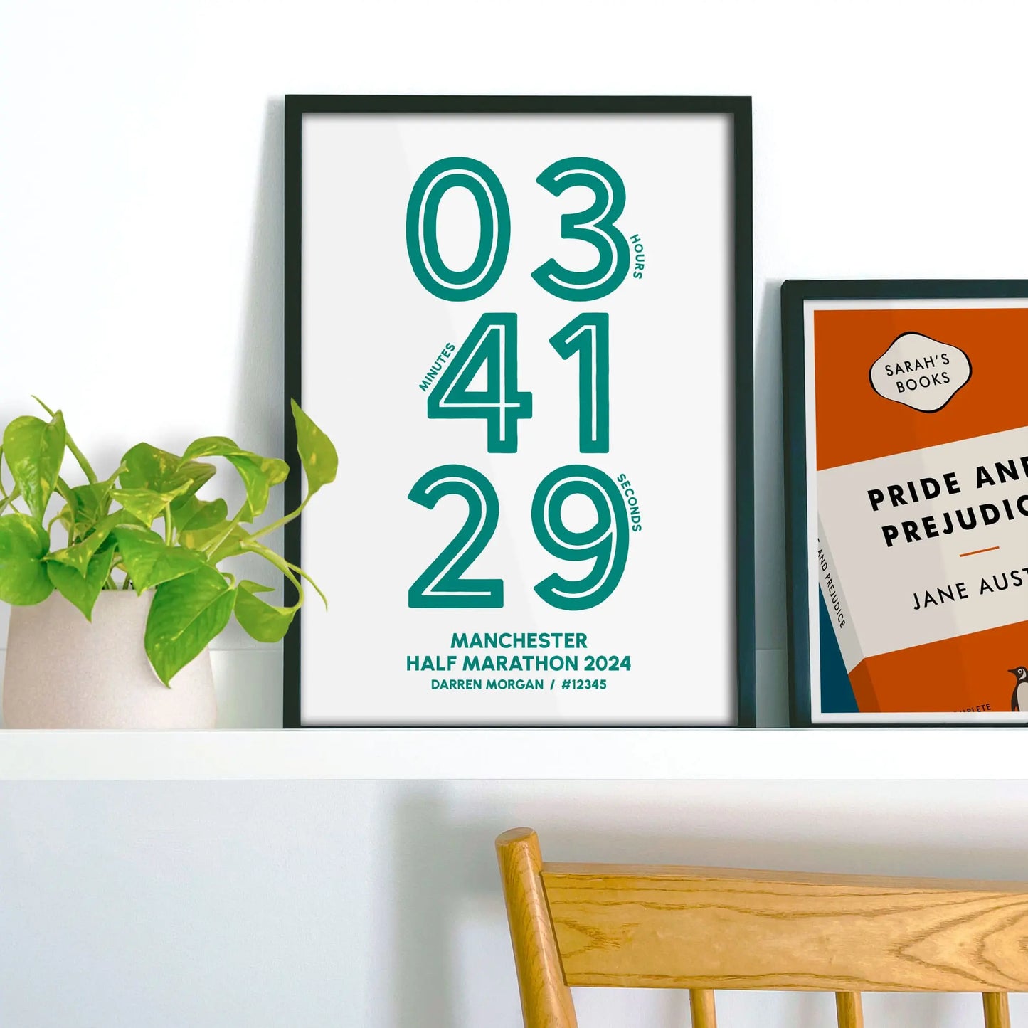 Finishers time marathon print on a shelf beside another personalised print