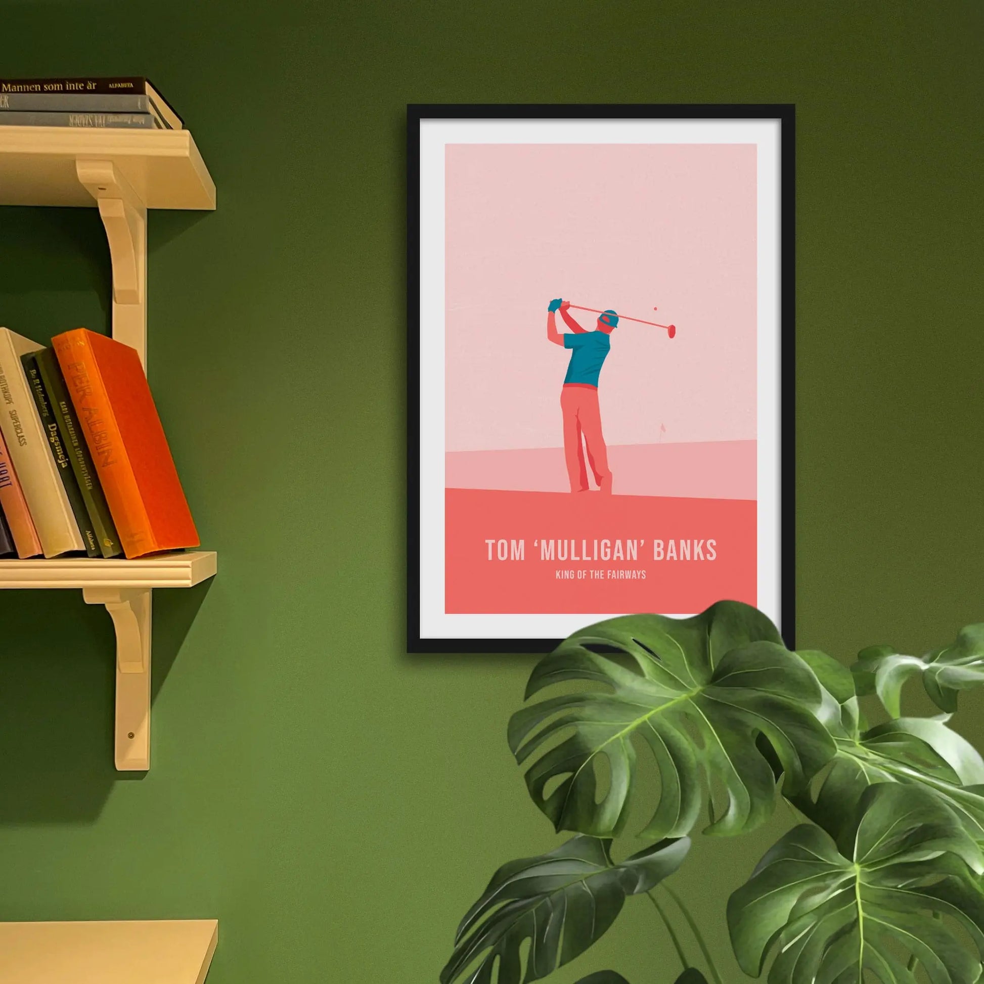 Framed art print on a green wall beside shelves.