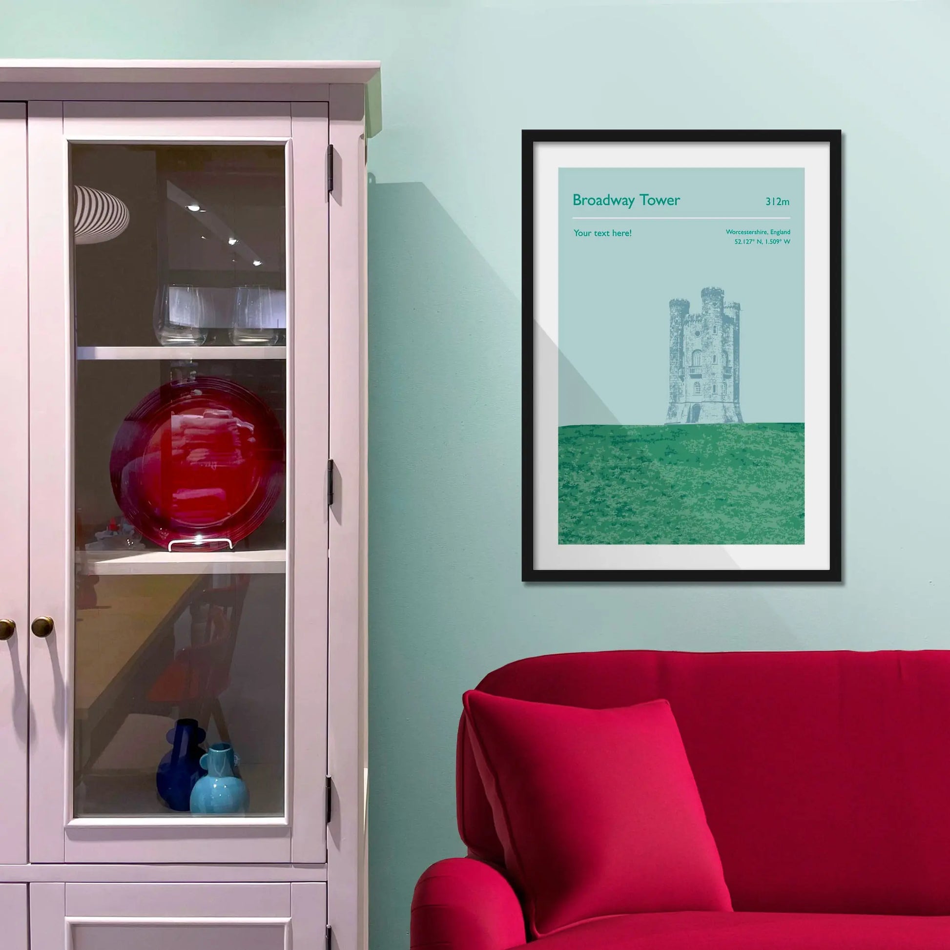 Framed picture on a baby blue wall beside pink shelving