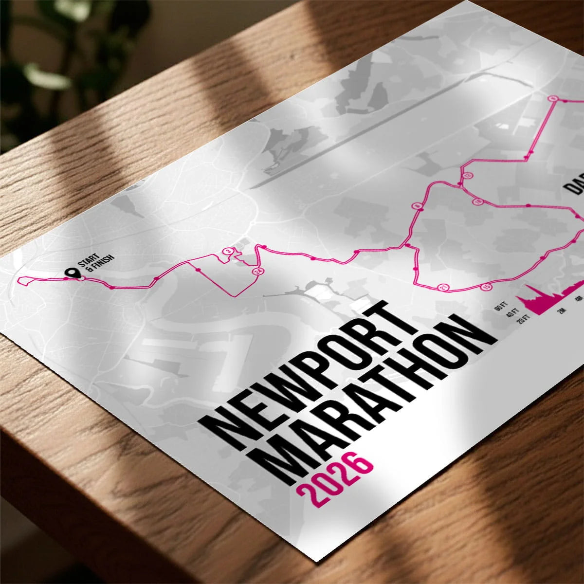 Personalised marathon print laying on wooden table top