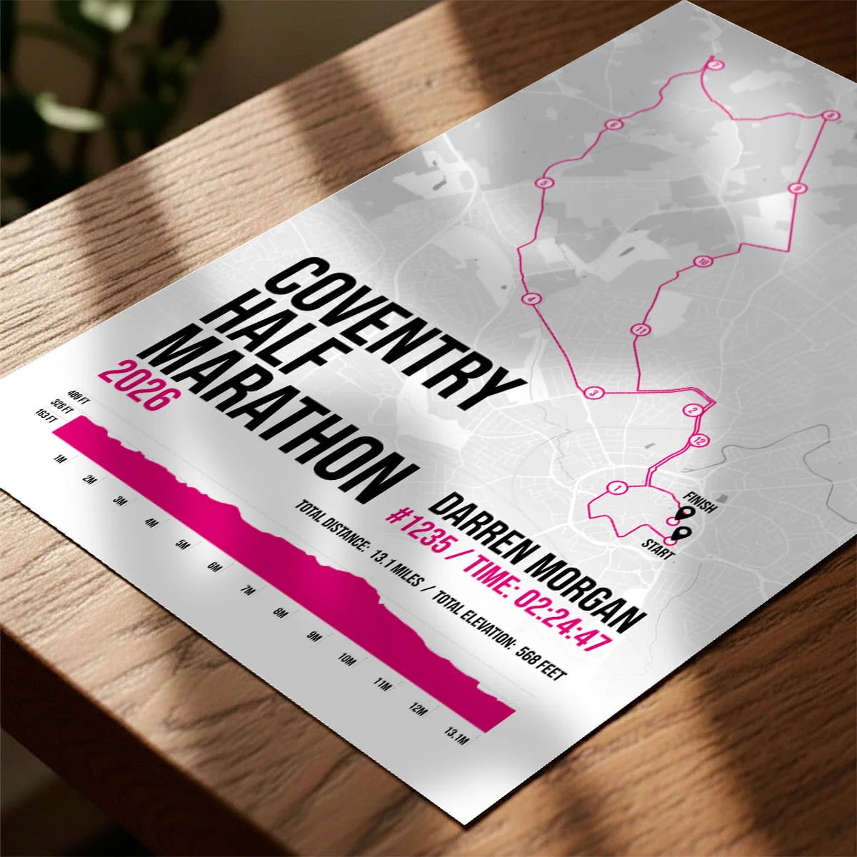 Personalised marathon print laying on wooden table top